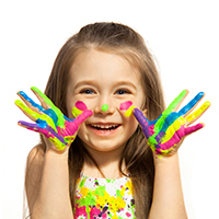 Preschooler with finger paint